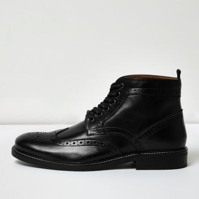 Black leather brogue boots